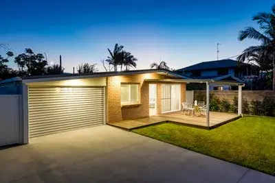A home at dusk with the garage door closed